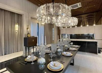 Elegant dining room with modern chandelier and dining setup