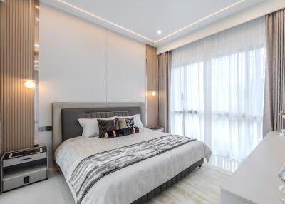 Modern bedroom with large windows and contemporary decor