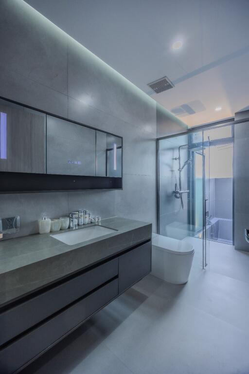 Modern bathroom with sleek fixtures and glass shower