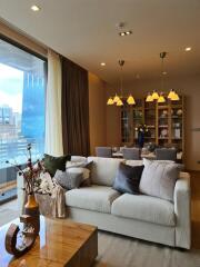 Modern living room with dining area and large windows