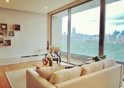 Cozy living room with large windows and city view