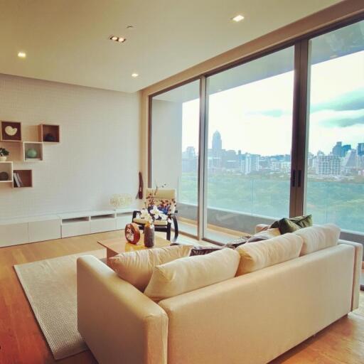 Cozy living room with large windows and city view