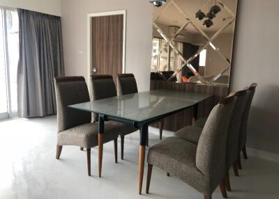 Modern dining room with glass table and six chairs