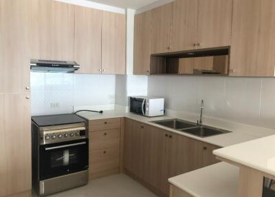 Modern kitchen with wooden cabinets and appliances