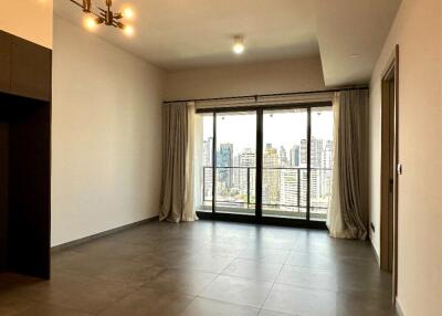 Spacious main living area with large windows and balcony access