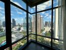 Cityscape view from a high-rise building with large windows