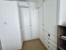 Bedroom with ample wardrobe space and air conditioning