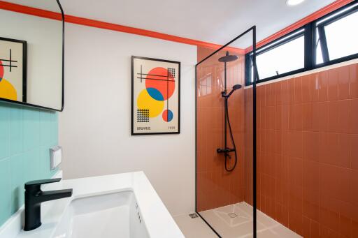 Modern bathroom with shower and abstract art