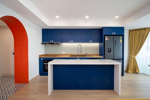 Modern kitchen with blue cabinetry and island