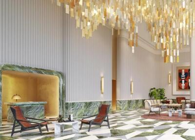 Luxurious lobby area with modern furniture and stunning chandelier