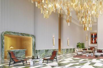 Luxurious lobby area with modern furniture and stunning chandelier