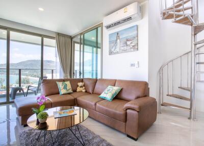 Modern living room with large windows and scenic views