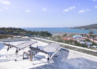 Stunning ocean view from the balcony with sun loungers