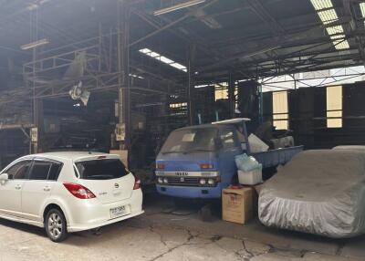 Vehicles parked inside an industrial warehouse