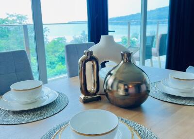 Dining table with tableware and decorative items