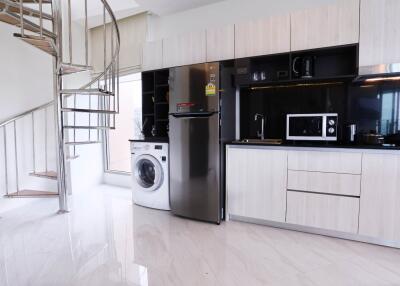 Modern kitchen with spiral staircase