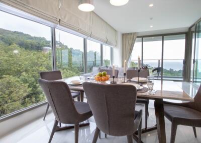 Bright and modern dining area with large windows and stunning views