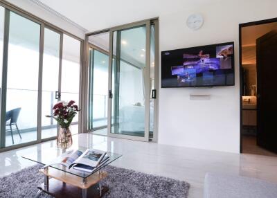 Modern living room with balcony and TV