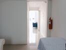 Bright hallway with a view into another room