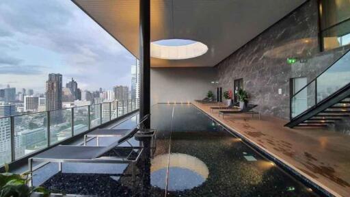 Luxury indoor swimming pool area with a city view