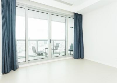 Living room with large glass doors and curtains