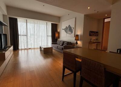 Spacious living room with modern decor and natural light