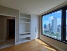 Bedroom with built-in shelves and large window