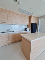 Modern kitchen with wooden cabinetry and island