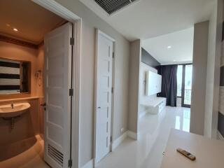 Modern apartment hallway with bathroom and living area