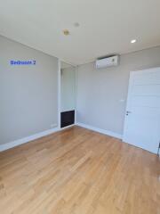 Empty bedroom with hardwood floor