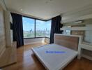 Master bedroom with large windows and city view