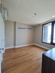 Bedroom / Study with wooden flooring and natural light