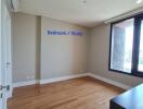 Bedroom / Study with wooden flooring and natural light