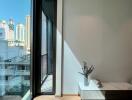 Bedroom with large glass window and city view