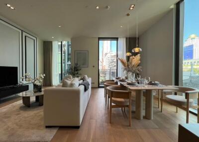 Modern living room with dining area and large windows