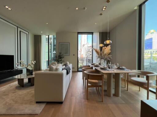 Modern living room with dining area and large windows