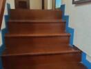 Wooden staircase with blue accents