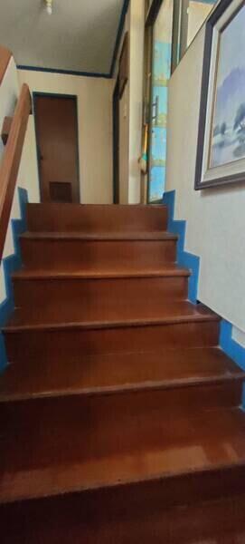 Wooden staircase with blue accents