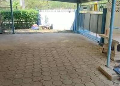 Covered garage with tiled floor