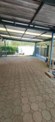 Covered garage with tiled floor