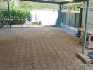 Covered garage with tiled floor