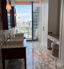 modern bathroom with dual sinks and city view