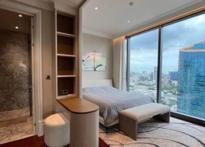 Modern bedroom with large windows and city view