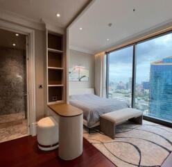 Modern bedroom with large windows and city view