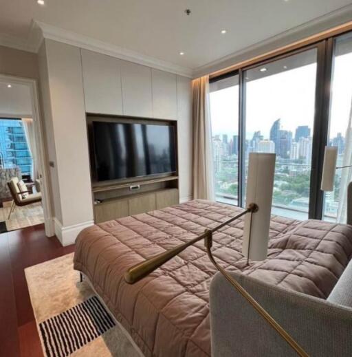 Modern bedroom with large window and city view