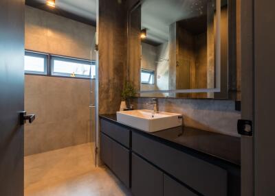 Modern bathroom with large mirror and sleek sink