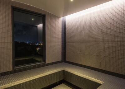 Modern tiled bathroom with built-in seating