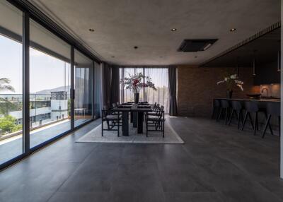 Modern dining room with large windows and a view