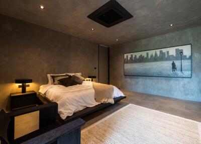 Modern minimalist bedroom with large wall artwork