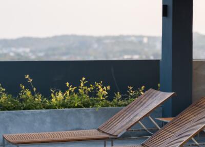 Modern outdoor lounge area with sun loungers